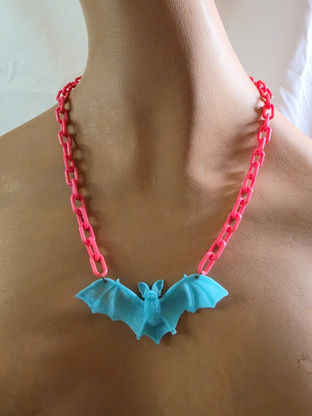 Bright Pink Plastic Link with Blue Bat Necklace.